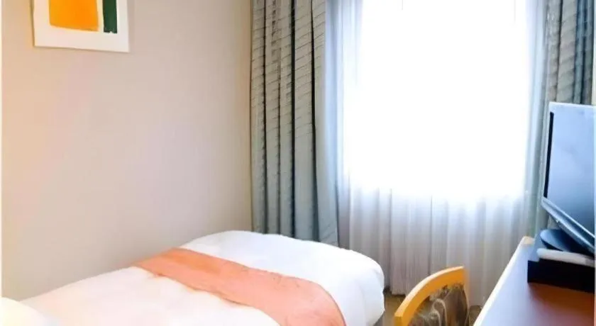 Bed in Takamatsu Park Hotel