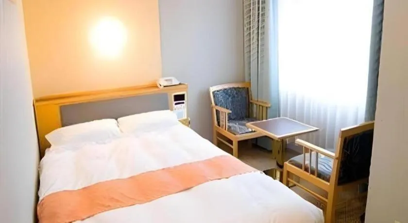 Bed in Takamatsu Park Hotel