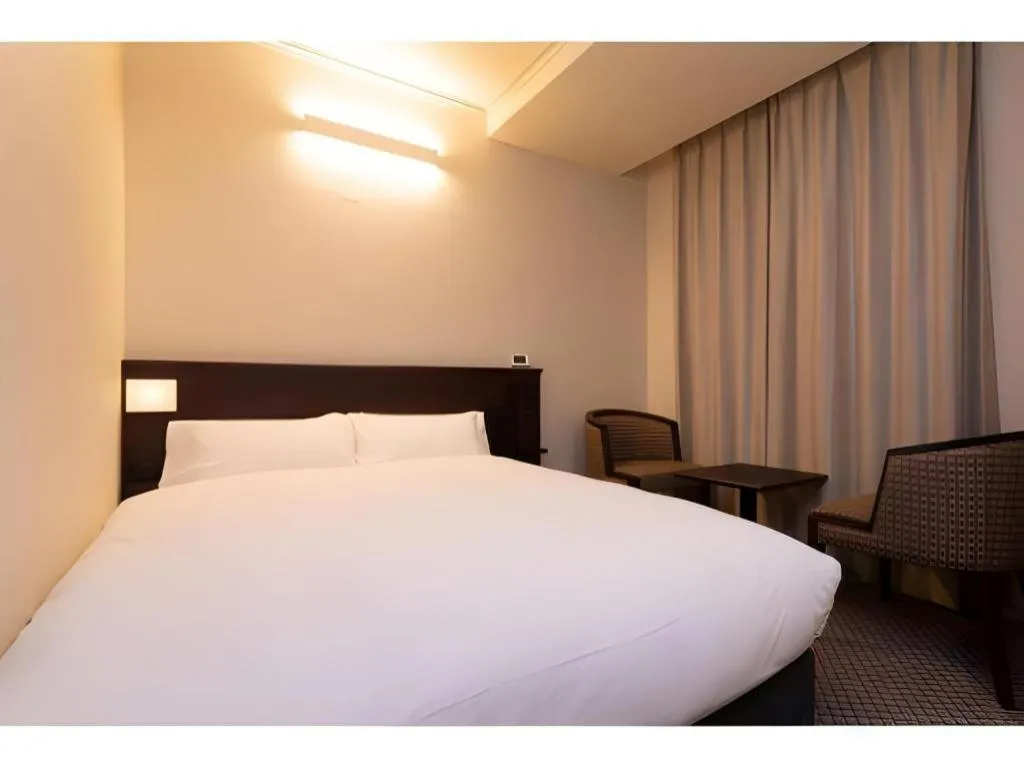 Bed in Takamatsu Park Hotel