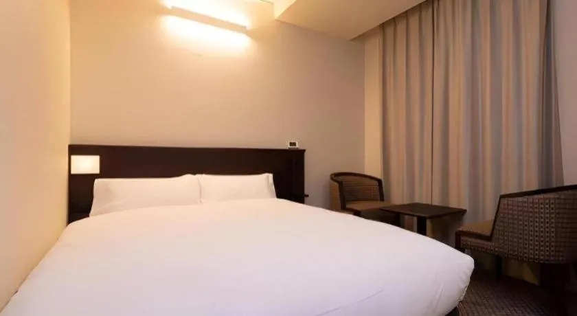 Bed in Takamatsu Park Hotel