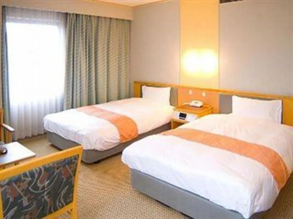 Bed in Takamatsu Park Hotel
