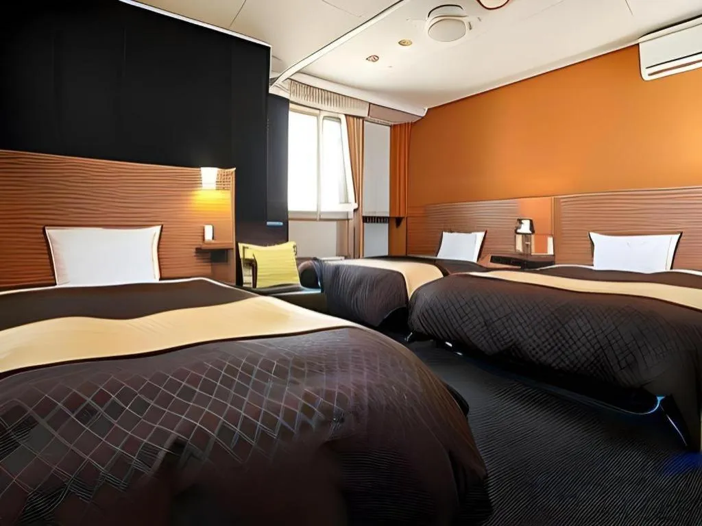 Bed in Hotel 1-2-3 Kofu Shingen Onsen