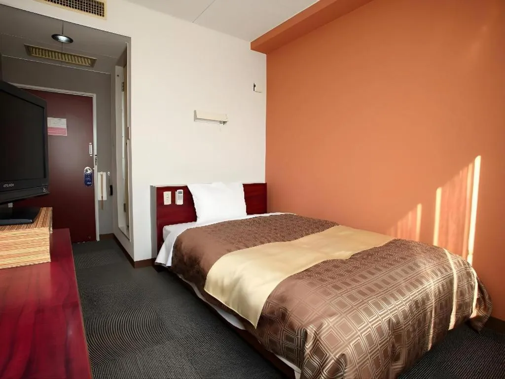 Bed in Hotel 1-2-3 Kofu Shingen Onsen