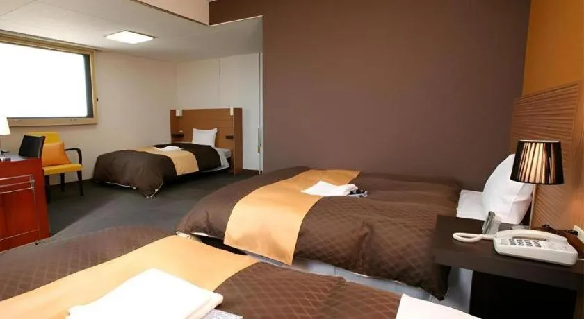 Bed in Hotel 1-2-3 Kofu Shingen Onsen