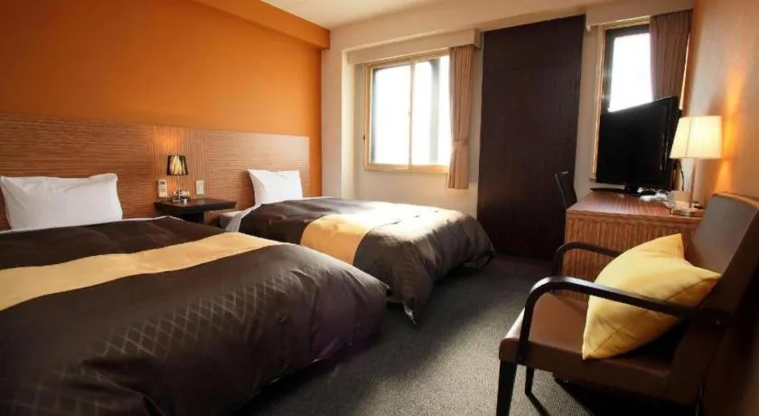 Bed in Hotel 1-2-3 Kofu Shingen Onsen