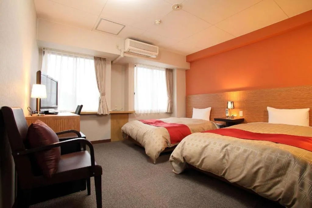 Bed in Hotel 1-2-3 Kofu Shingen Onsen