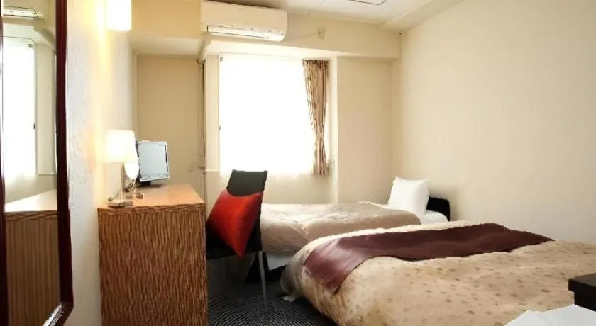 Bed in Hotel 1-2-3 Kofu Shingen Onsen