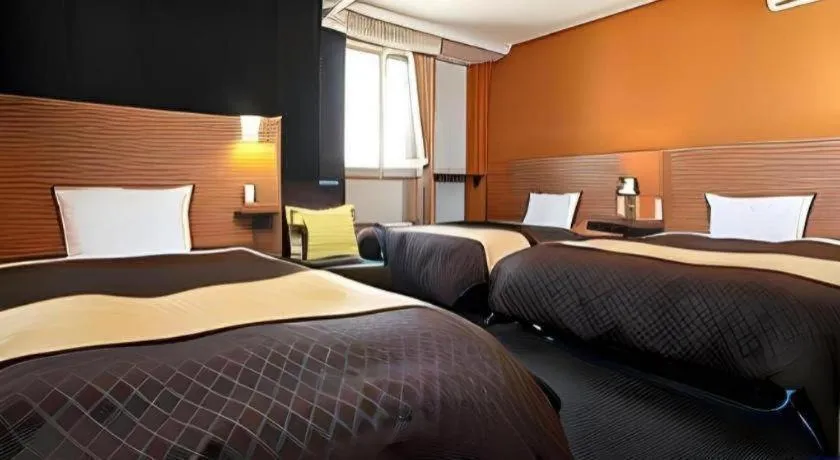 Bed in Hotel 1-2-3 Kofu Shingen Onsen