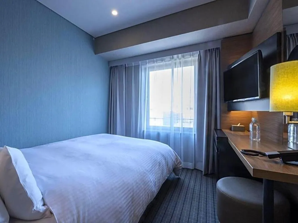 Bed in HOTEL UNIZO Osaka Yodoyabashi