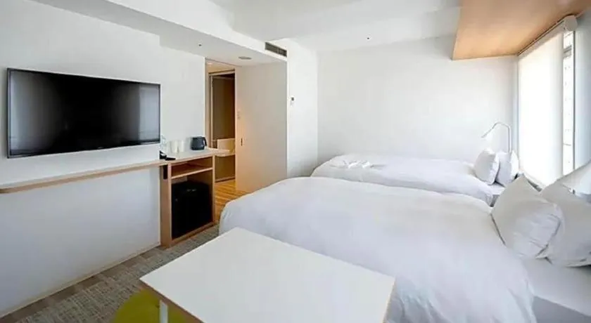 Bed in HOTEL UNIZO Osaka Yodoyabashi