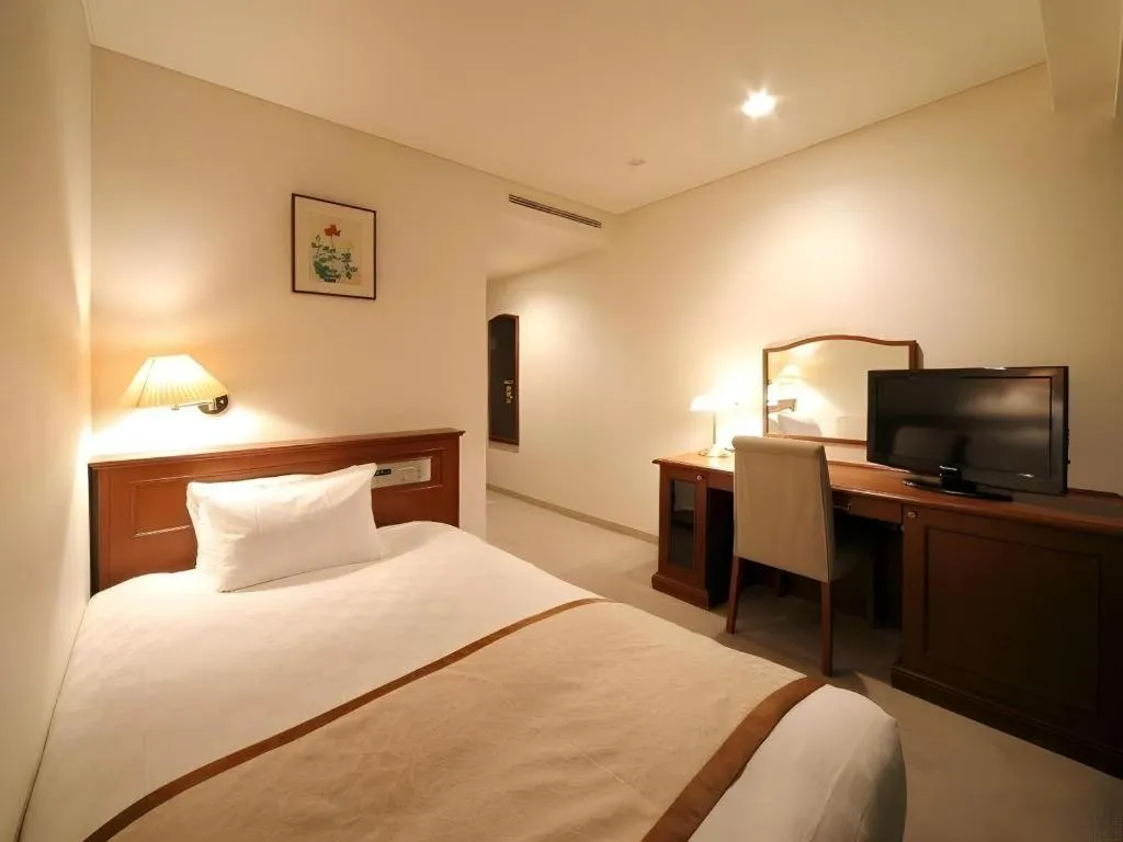 Bed in Hotel Harvest In Yonago