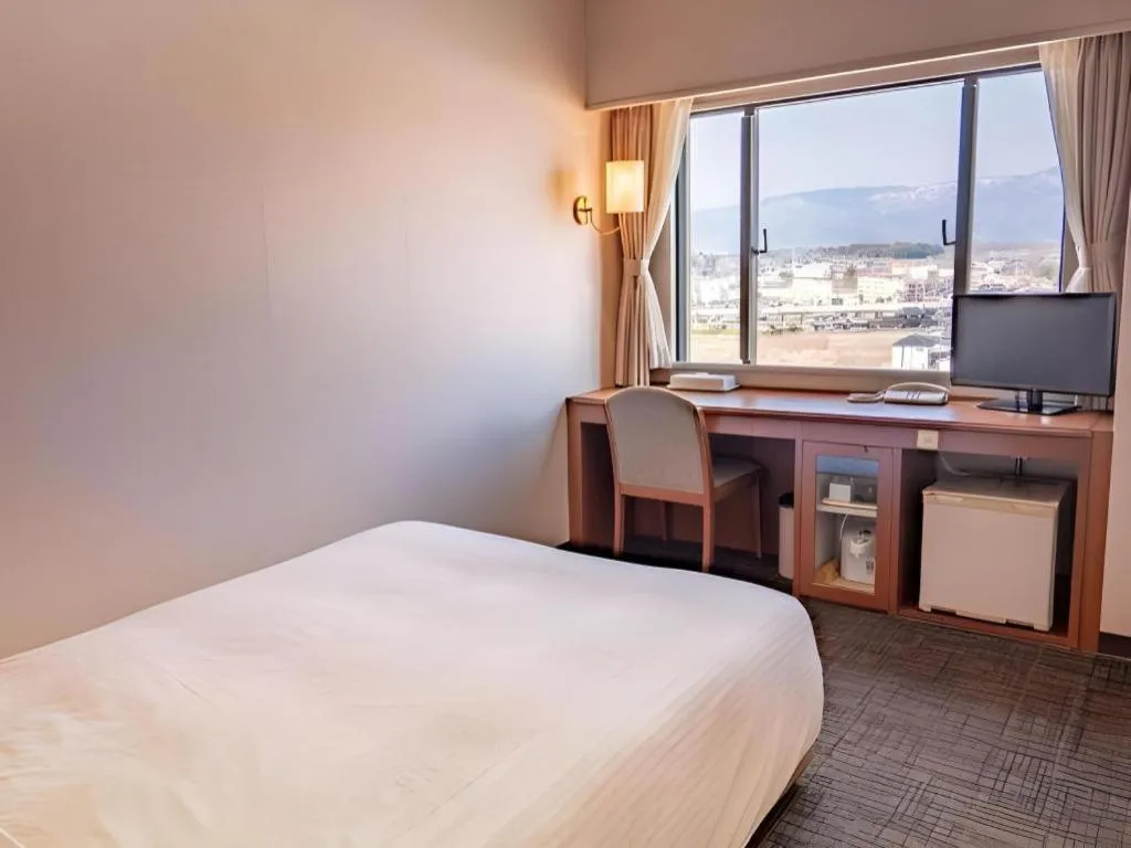 Bed in Imazu Sun Bridge Hotel