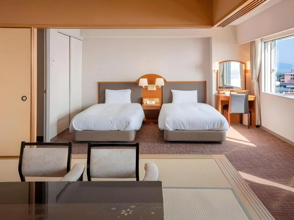 Bed in Imazu Sun Bridge Hotel