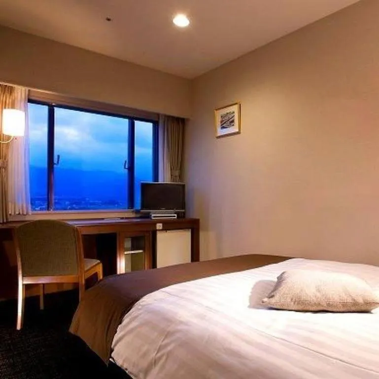 Bed in Imazu Sun Bridge Hotel