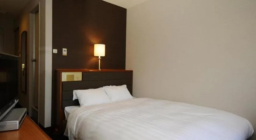 Bed in Imazu Sun Bridge Hotel