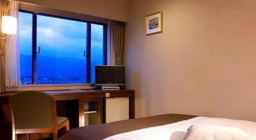 Bed in Imazu Sun Bridge Hotel