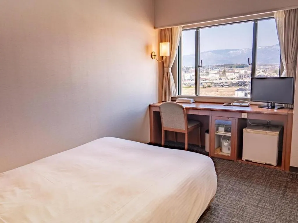 Bed in Imazu Sun Bridge Hotel