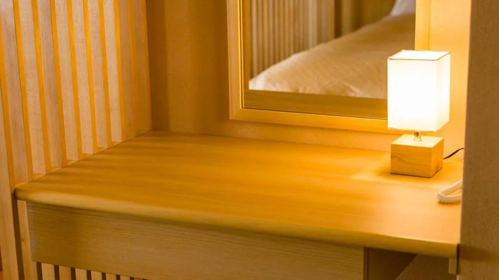 Bed in Shinojima Royal Hotel Kasuisou