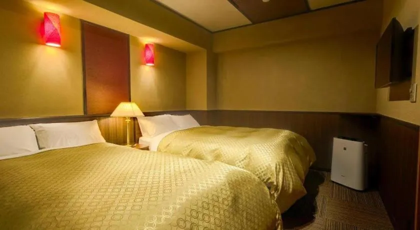 Bed in Shinojima Royal Hotel Kasuisou