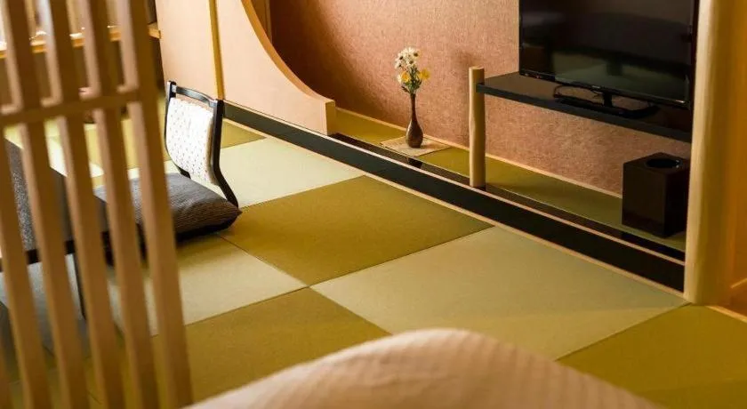 Bed in Shinojima Royal Hotel Kasuisou