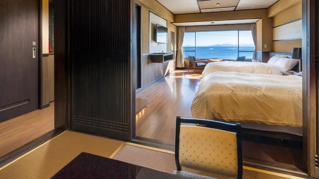 Bed in Shinojima Royal Hotel Kasuisou