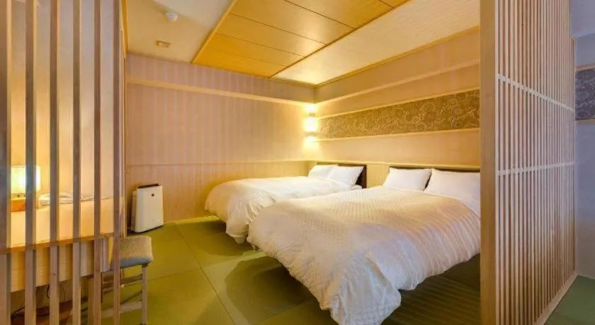 Bed in Shinojima Royal Hotel Kasuisou