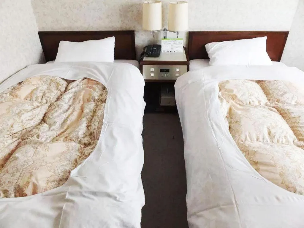 Bed in Sento Otani Hotel