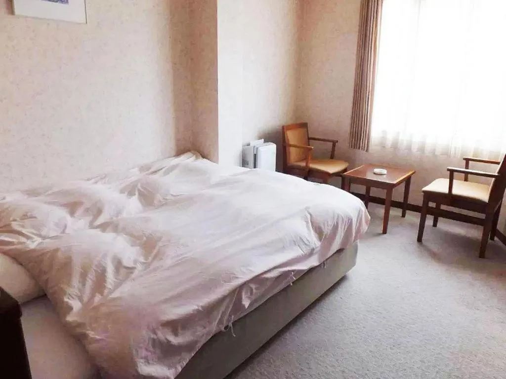 Bed in Sento Otani Hotel