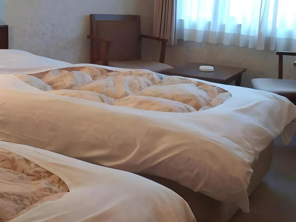 Bed in Sento Otani Hotel