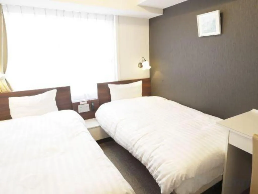 Bed in Hotel Shimbashi Sambankan