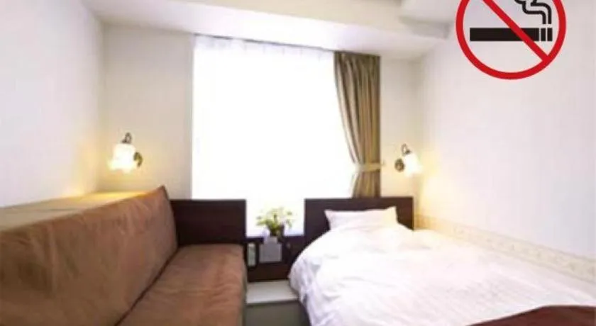 Bed in Hotel Shimbashi Sambankan