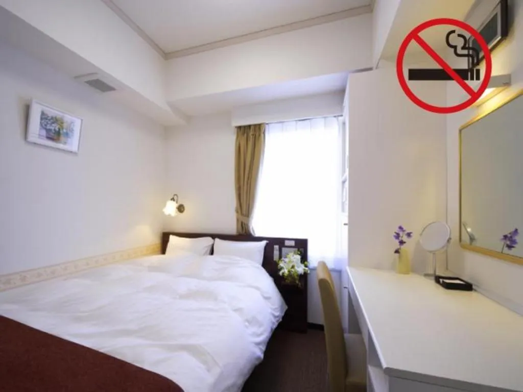 Bed in Hotel Shimbashi Sambankan