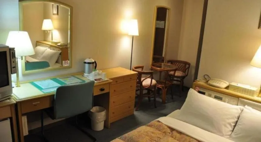 Bed in Palace Inn Toyota