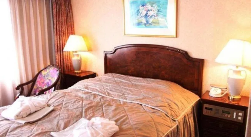 Bed in Palace Inn Toyota