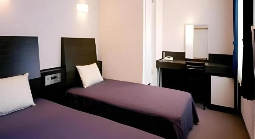 Bed in Hirata Maple Hotel