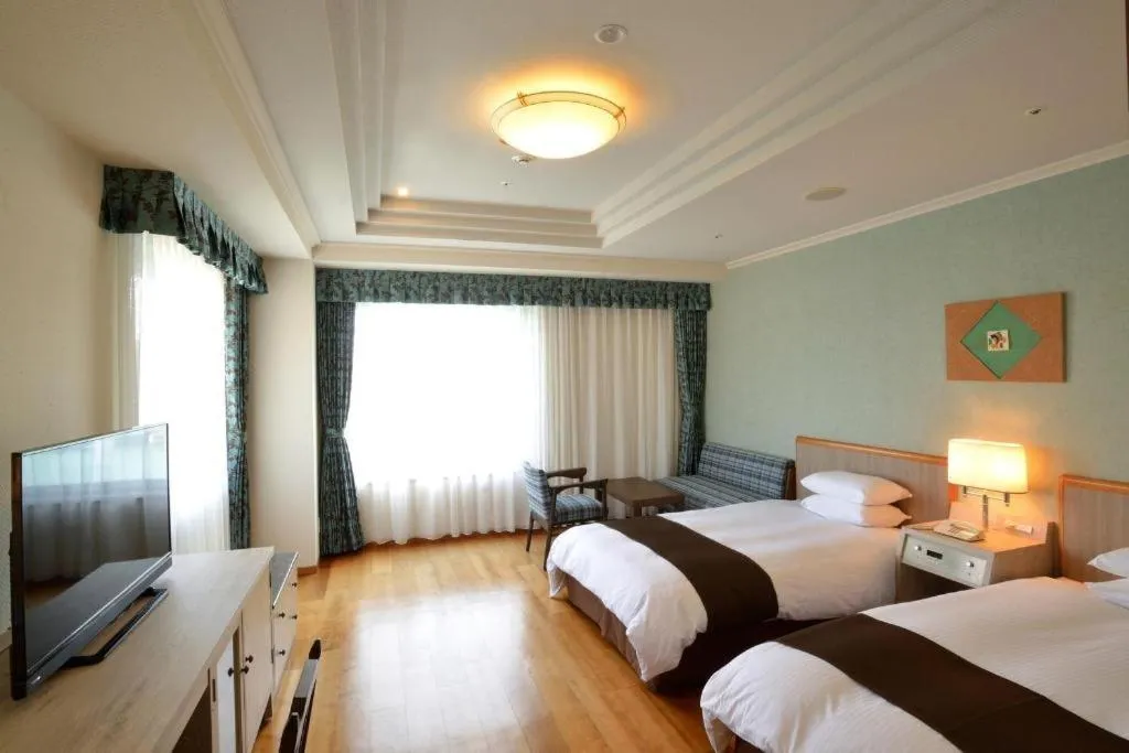 Bed in Green Hill Hotel Onomichi