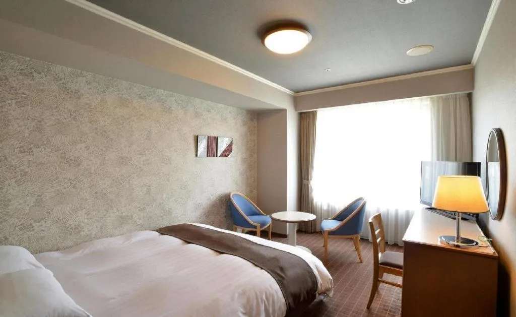 Bed in Green Hill Hotel Onomichi