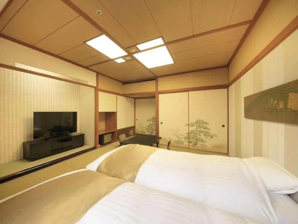 Bed in Centurion Hotel Technoport Fukui- Artificial Radium Hot Spring