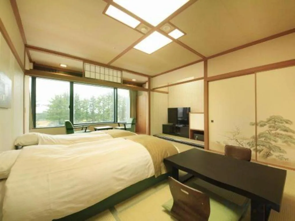 Bed in Centurion Hotel Technoport Fukui- Artificial Radium Hot Spring