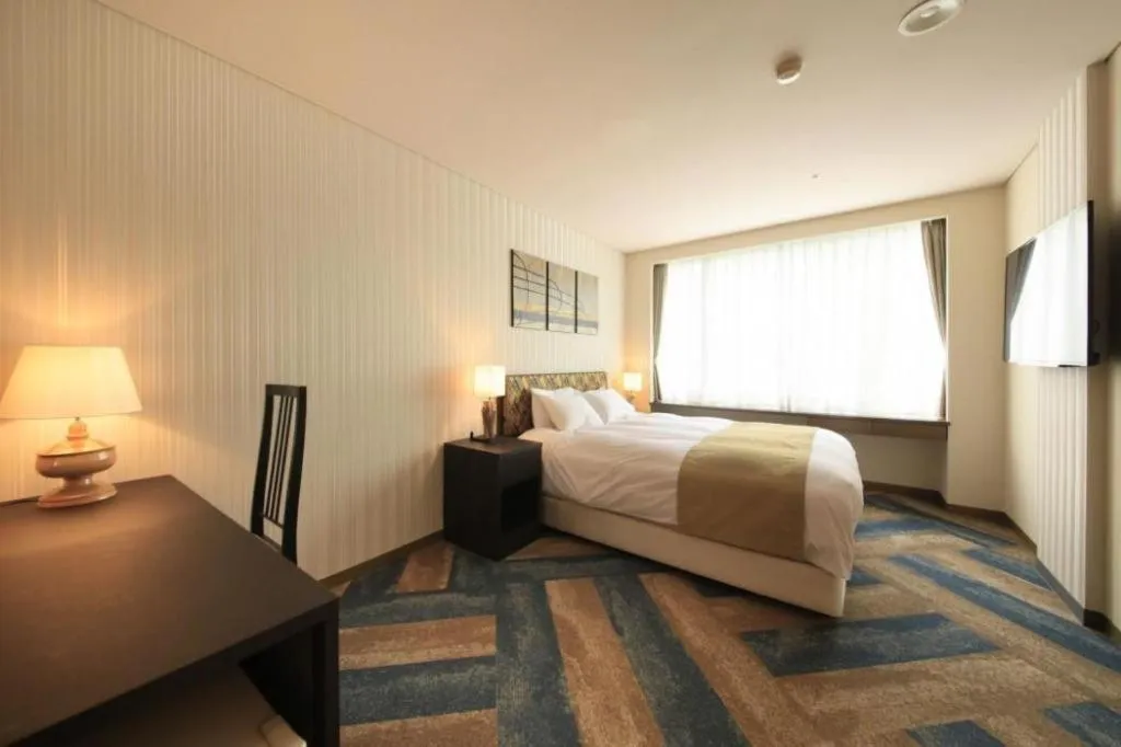 Bed in Centurion Hotel Technoport Fukui- Artificial Radium Hot Spring