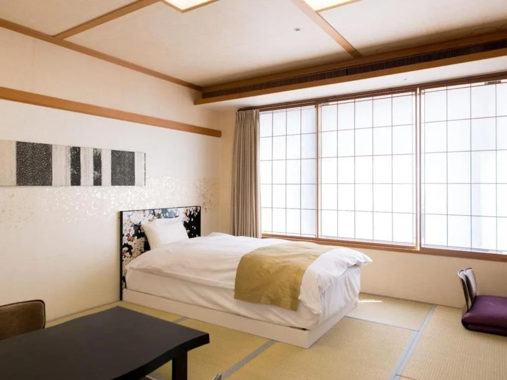 Bed in Centurion Hotel Technoport Fukui- Artificial Radium Hot Spring