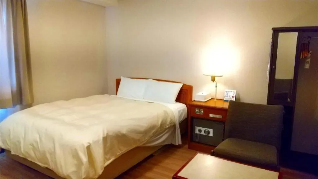 Bed in Ichimanri Hotel Golden Century