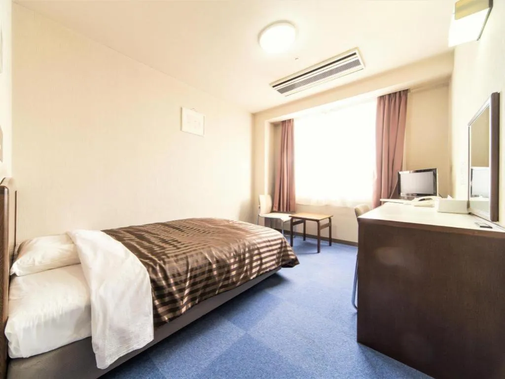 Bed in Ichimanri Hotel Golden Century