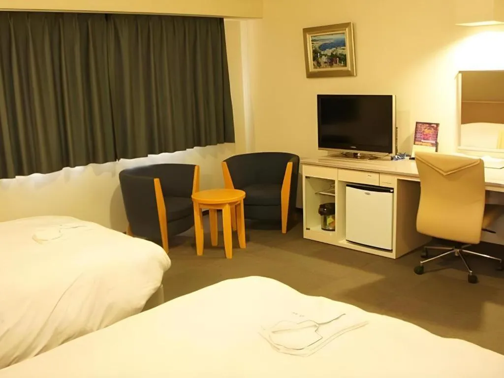 Bed in Shiroko Storia Hotel