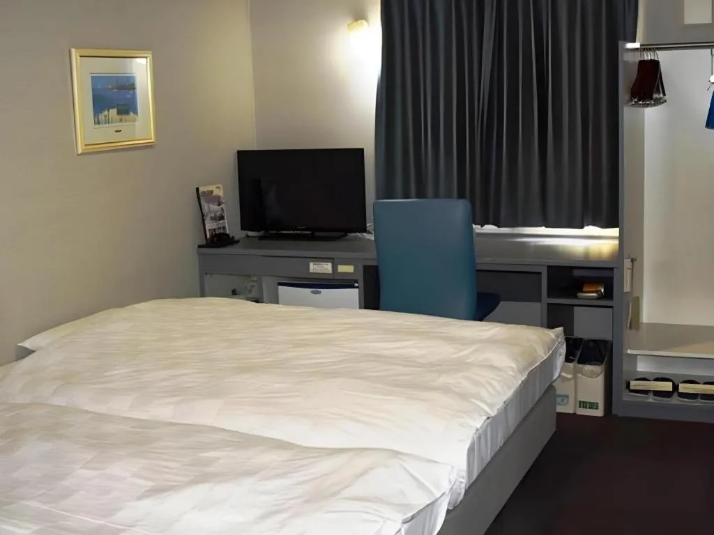 Bed in Shiroko Storia Hotel