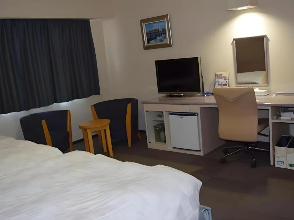 Bed in Shiroko Storia Hotel