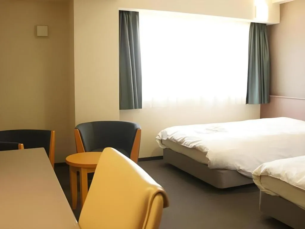 Bed in Shiroko Storia Hotel