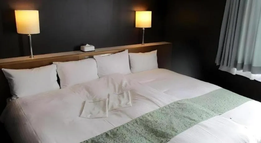Bed in Niigata Keihin Hotel