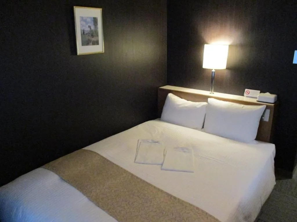 Bed in Niigata Keihin Hotel