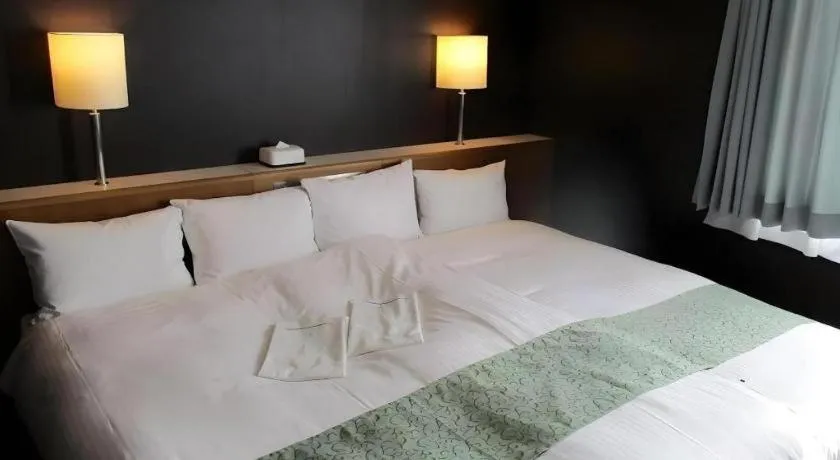 Bed in Niigata Keihin Hotel